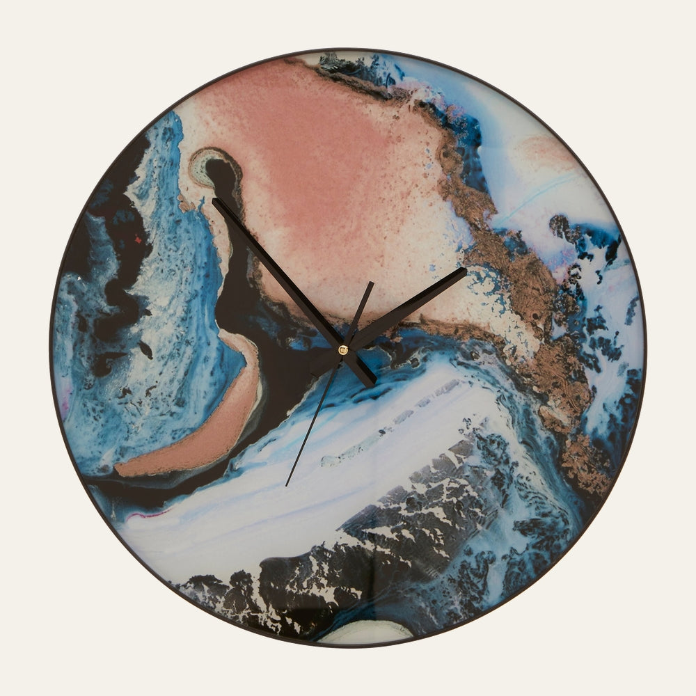 Xandor Round Clock — round wall clock with abstract marbled blue, white and pink face, metallic gold accents, slim black hands and thin black rim