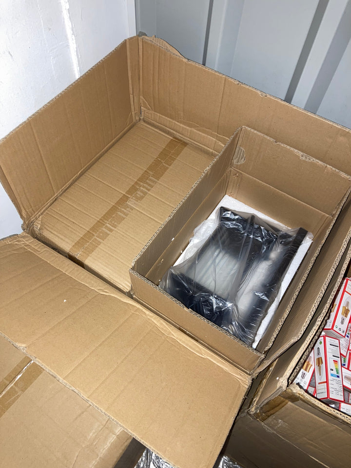 Black outdoor wall light packed securely in warehouse stock with included LED bulbs visible nearby